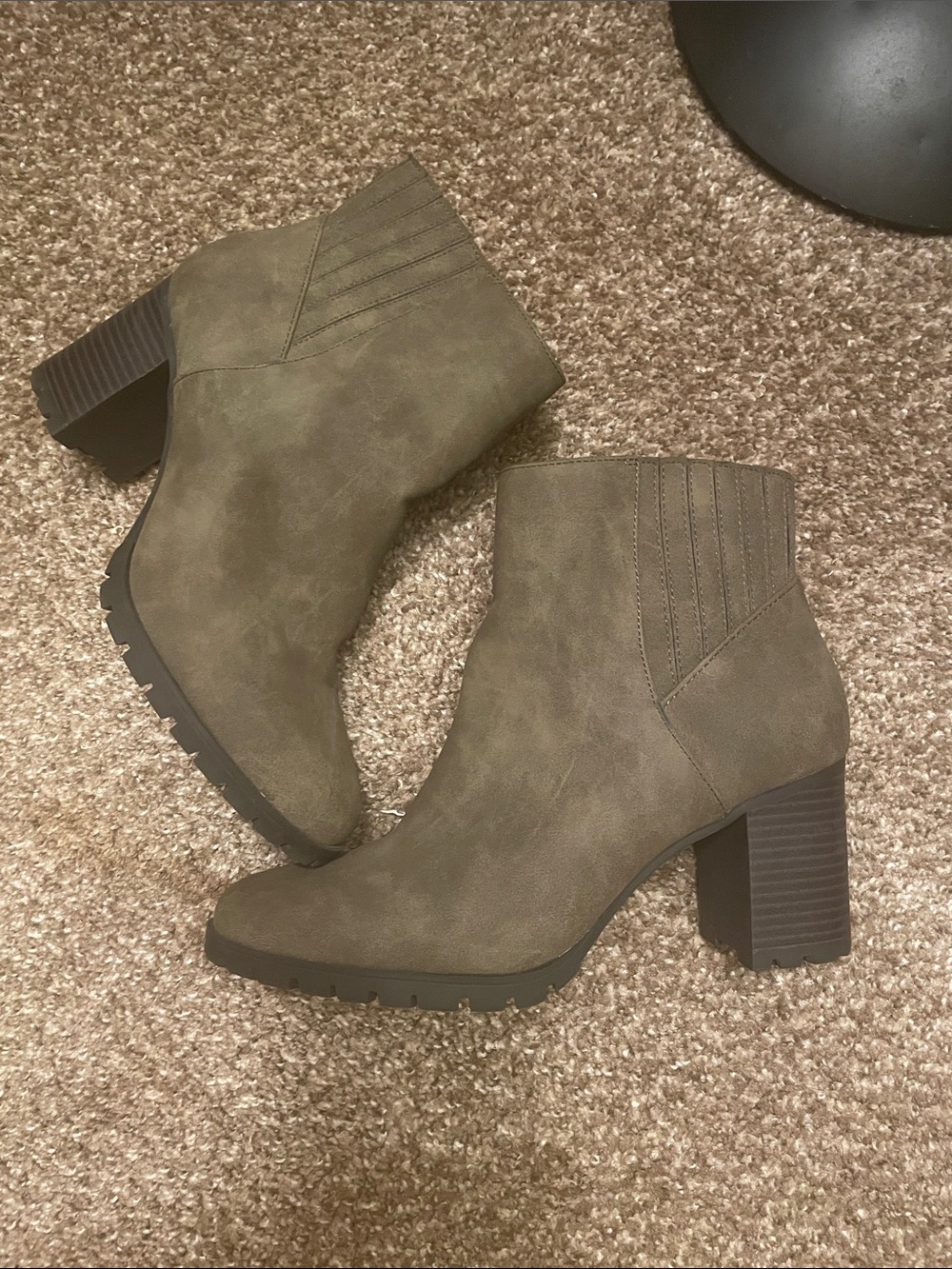 Sage green heeled boots with detail on ankle